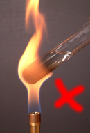 Heating with a yellow flame blackens the apparatus