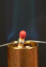 Matchhead at the centre of a blue Bunsen flame