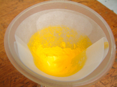 The solid residue remains in the filter paper