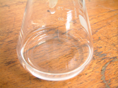 A clear filtrate goes into the conical flask