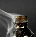 open ethanoyl chloride bottle with steamy fumes