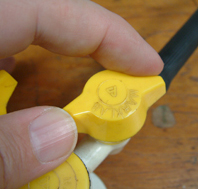 Adjusting a Bunsen burner at the gas tap