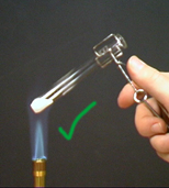 Correct heating with the test tube just above the inner blue cone