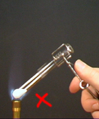 Incorrect heating - the test tube is in the inner, unburnt gas section of the flame