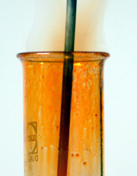 Thermal decomposition of hydrogen bromide showing brown bromine vapour