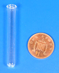 An ignition tube and penny for scale