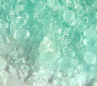 Some pale green crystals of iron(II) sulphate-7-water. If you look carefully you can see some traces of oxidation (brown).
