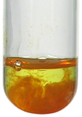 A rusty brown precipitate