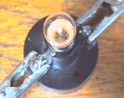 The brightness of the lamp shows the conductivity of the solution