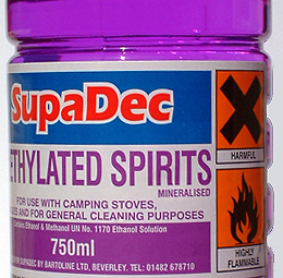 A bottle of purple commercial methylated spirits