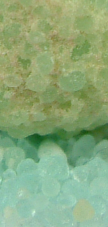 Sample of green iron(II) sulphate showing surface oxidation to yellow iron(III)