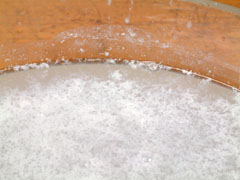 Hard water with soap showing scum and no lather