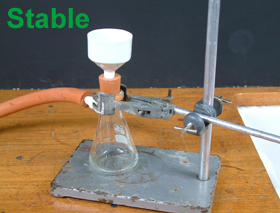 Heavy vacuum tubing can pull the flask over