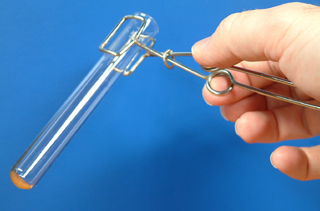 Test tube holders in the correct place on a test tube